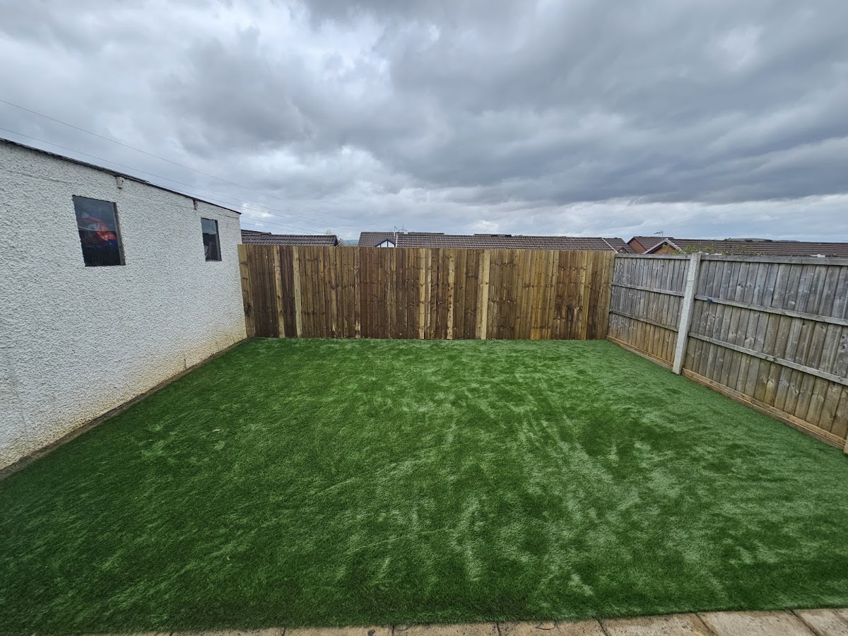 Artificial grass rear lawn with new close board fencing